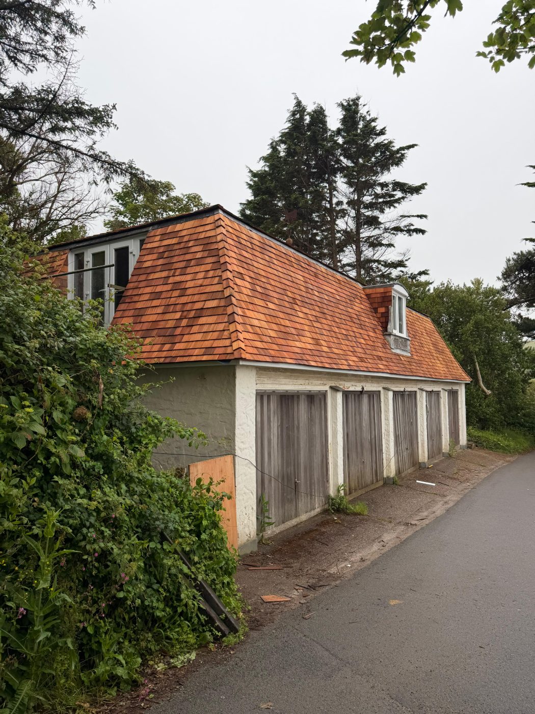 Mansard — garage block with a new hand-laid cedar shingle mansard roof